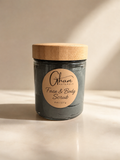 Charcoal & Tamanu Face + Body Scrub in an 8 oz glass jar
