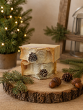 Frosted Fir Tallow Artisan Soap bars stacked with pinecones